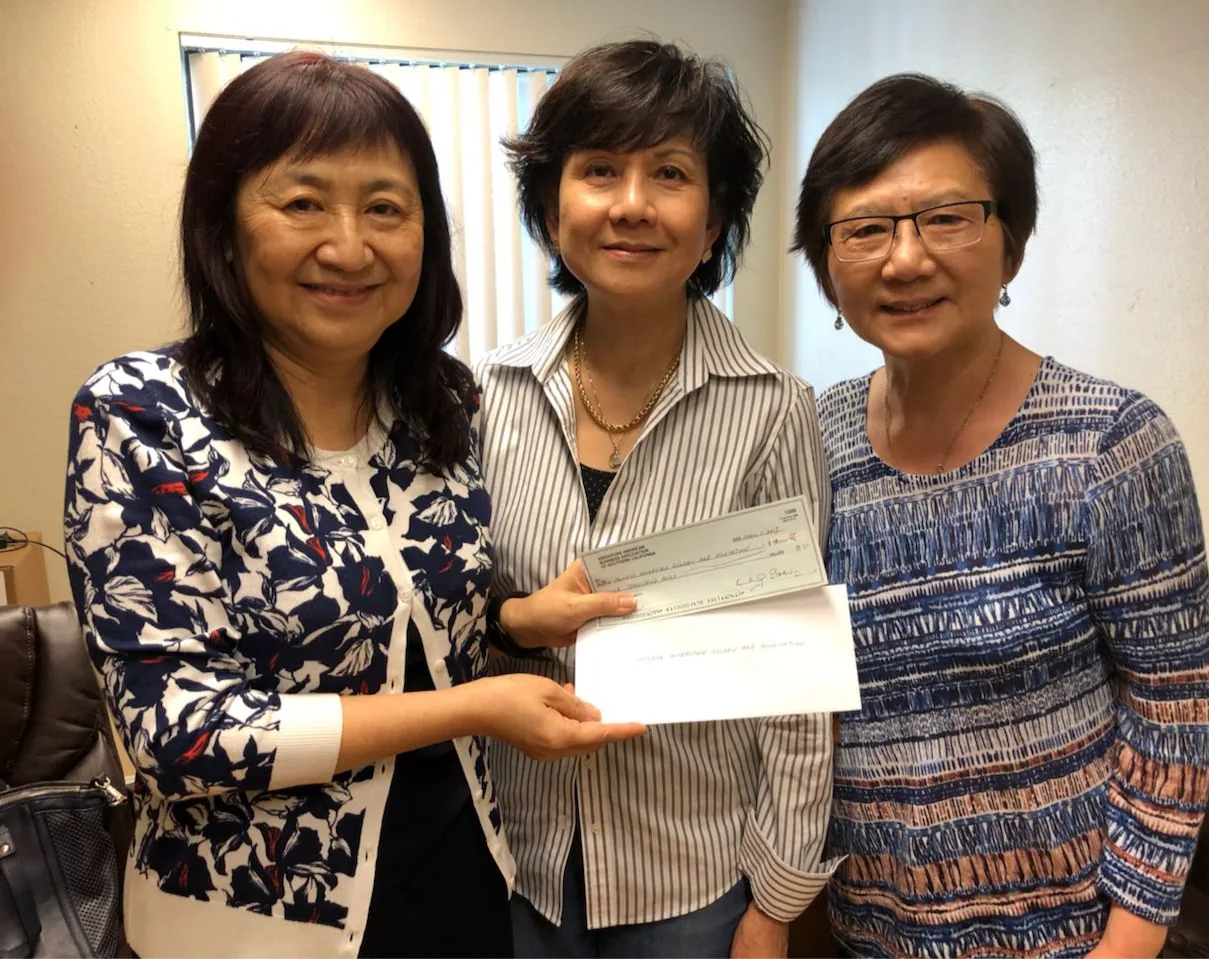 Donation check presentation at Golden Age Village