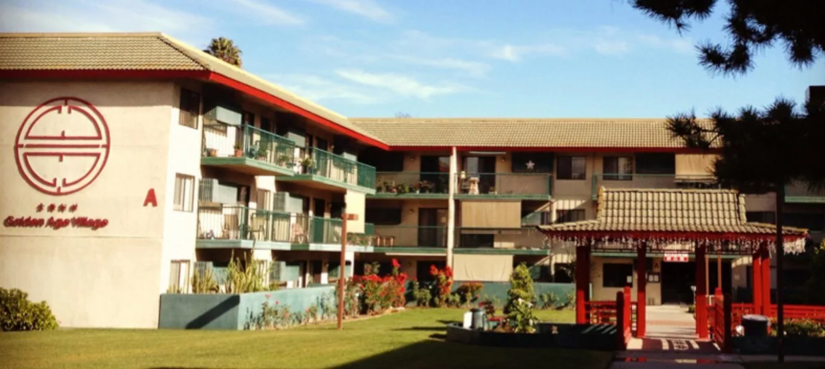 Golden Age Village building with its Chinese pavilion gate