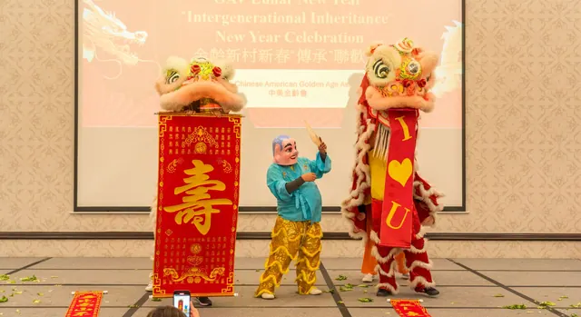 Lion dance performance with celebratory New Year scrolls