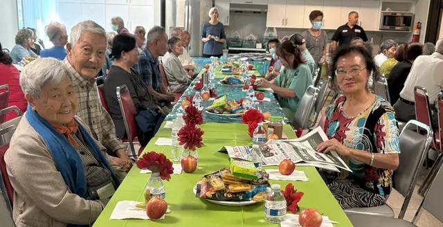 Residents around the table during the birthday gathering