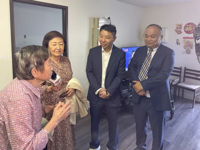 Guests chat with a resident in her home