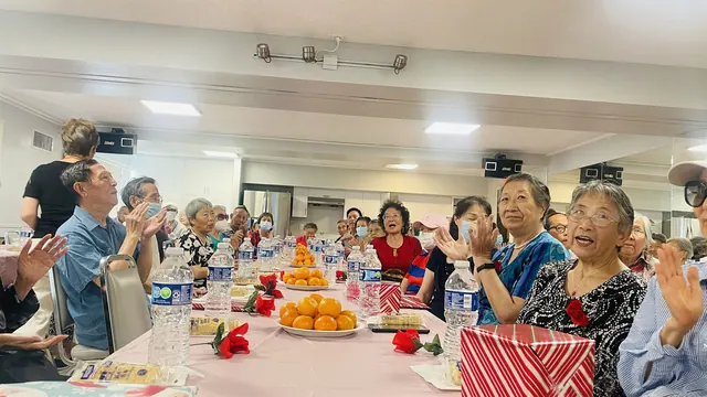 Residents applauding during the celebration