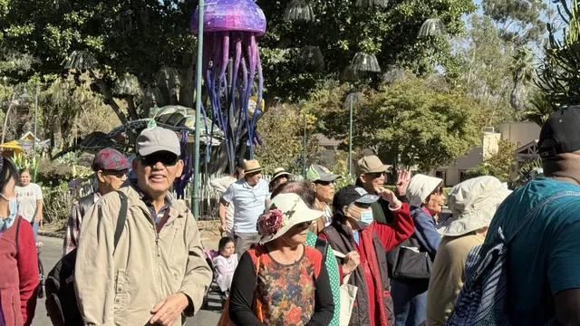 Visitors walking past a giant jellyfish lantern display