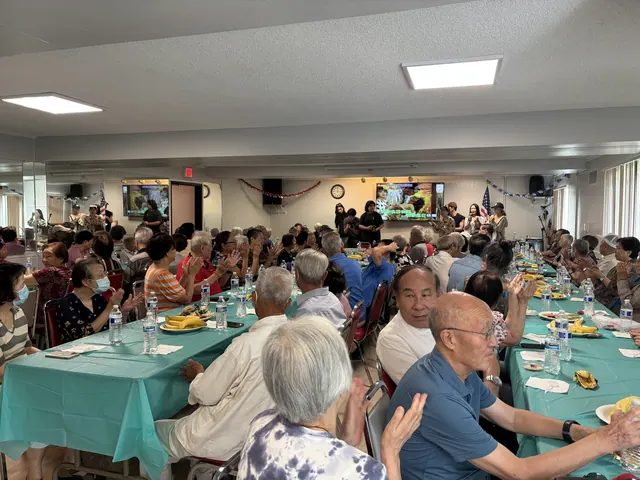 Residents applauding during the birthday celebration