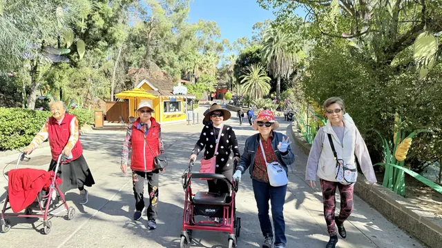 Residents walking along the zoo pathway