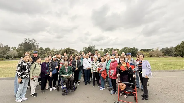 Residents pose for a group photo during an outing