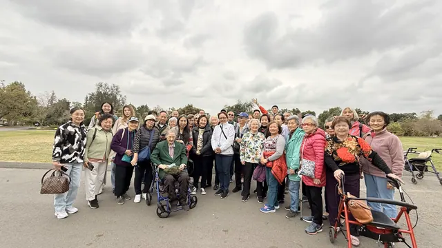 Another group photo of the outing party in front of the park lawns
