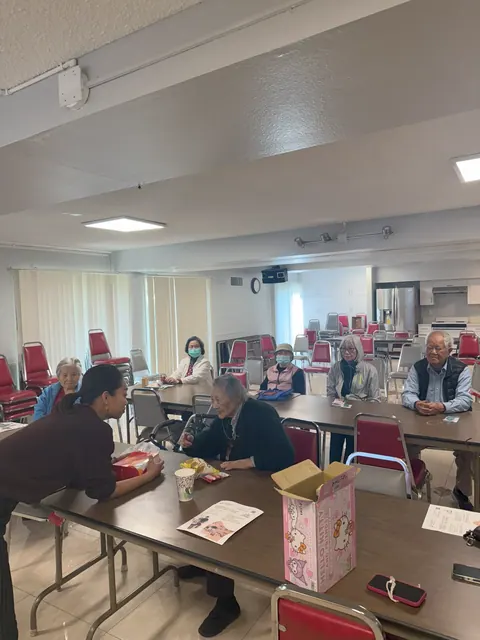 Residents seated around tables attending the seminar