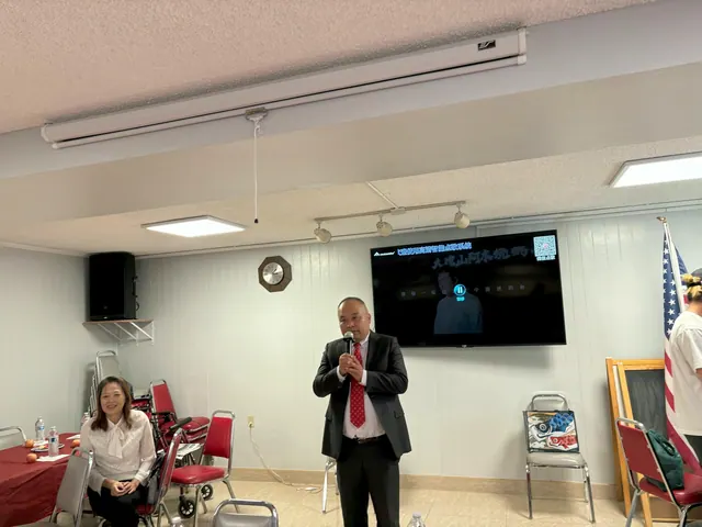 A guest addressing the gathering with a microphone