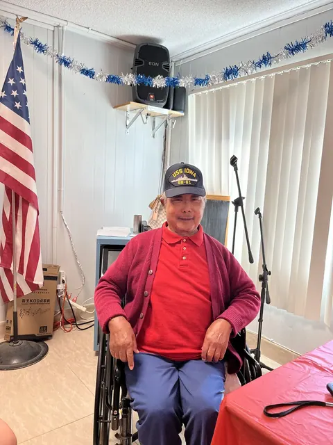 A resident at the birthday party in the activity room