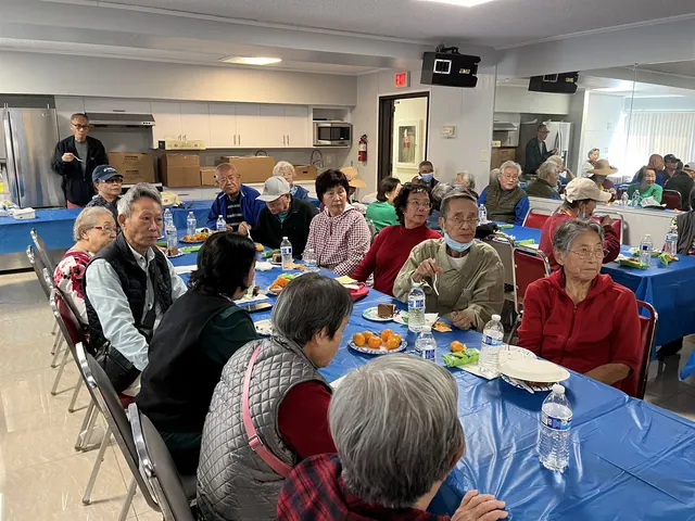 Residents sharing food together at the birthday party