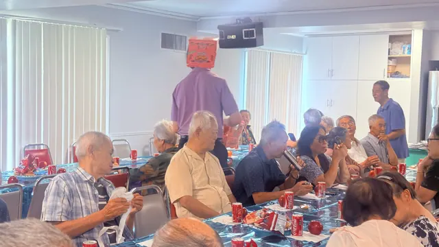 Residents laughing together at the birthday party