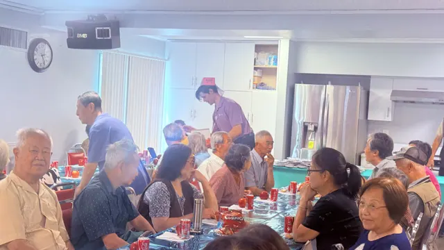 Residents at the birthday party in the activity hall