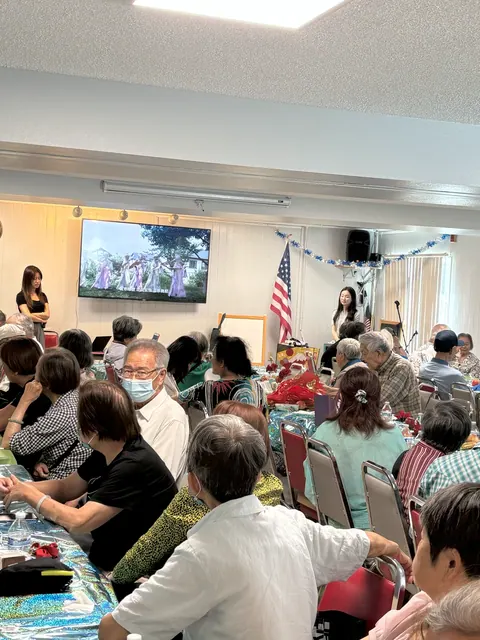 Speakers addressing residents during the program