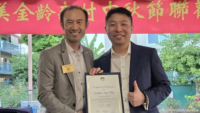 Monterey Park Vice Mayor Vinh T. Ngo presents a Certificate of Recognition