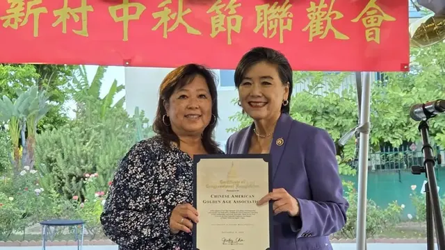 Congresswoman Judy Chu presents a Certificate of Congressional Recognition
