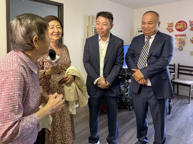 Guests visit a resident in her apartment