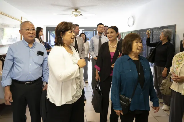 Visitors touring an indoor common area of the building