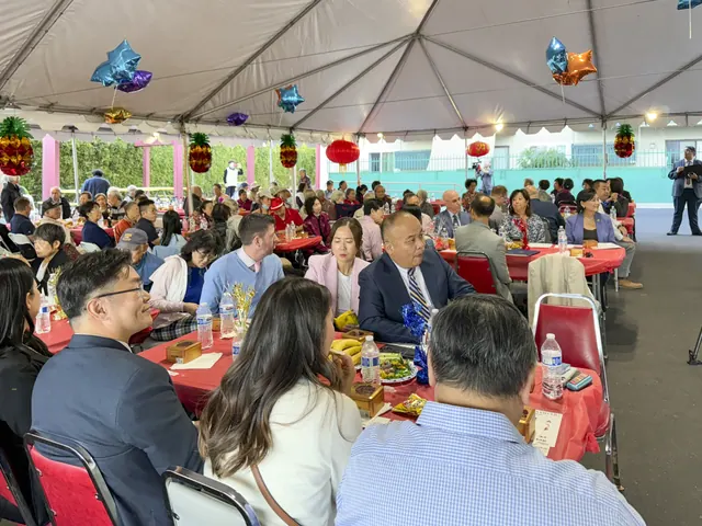 Guests seated at the party under the tent
