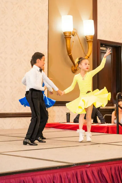 Young children performing a ballroom dance